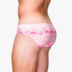 Detail of pink men's swim briefs featuring flamingo prints and slim-fit low-waist cut