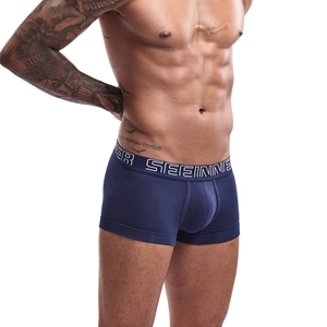 Detail of navy blue cotton boxer briefs featuring a wide branded elastic waistband