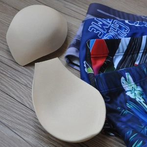 Close-up of removable skin-tone foam push-up pads for men's swimwear and trunks
