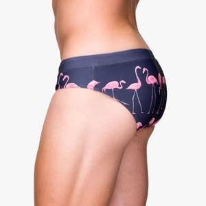 Detail of navy blue men swim briefs with pink flamingo print and low-rise cut