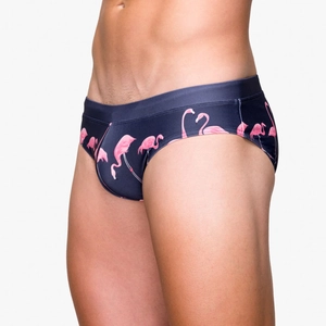 Detailed side view of men's navy blue swim briefs with pink flamingo pattern print