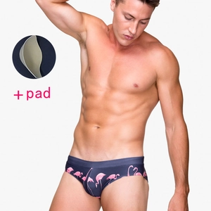 Men's navy blue swim briefs with pink flamingo print and removable protective pad