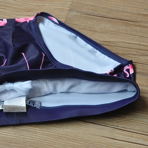 Detail of men's flamingo swim briefs showing white drawstring and breathable mesh lining