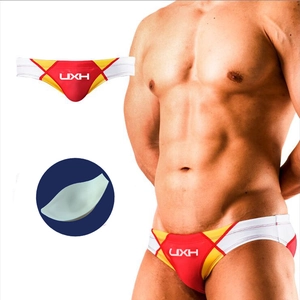 Detail of color-block swim briefs with removable push-up cup and front UXH logo