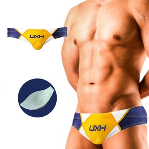 Men's geometric patchwork swim briefs with removable push-up cup padding detail