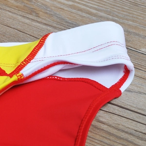 Close-up of color-block swimming briefs showing high-quality stitching and elastic fabric