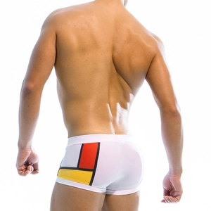 Men's tight swim trunks with Mondrian style geometric color block design on white back