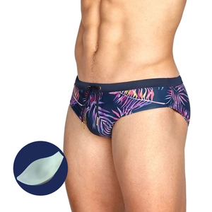 Men's navy swim briefs with pink tropical leaf print and removable padded cup inserts