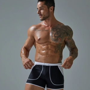 Detail of men's quick-dry swim trunks with contrast side stitching and adjustable drawstring