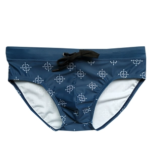 Men's navy swim briefs with white geometric arrow pattern and adjustable drawstring waist