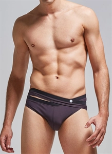 Detail of overlapping waist design and button on men's coffee purple swim briefs