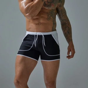 Detailed view of men's quick-dry swimming trunks with white drawstring and side stitching