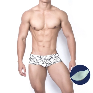 Men's low-rise swim trunks with black bamboo print and internal front contour padding