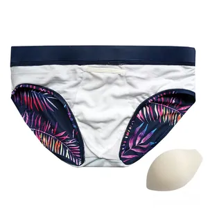 Detail of men's leaf print swim briefs showing the removable inner sponge pad insert