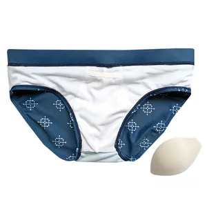 Detail view of men's geometric print swim briefs with a removable foam padding insert