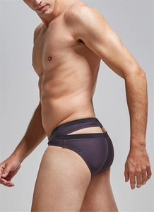 Detail view of purple men's swim briefs featuring stylish cutout back and sleek fabric