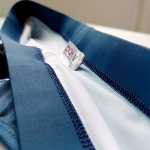 Detail view of high-quality stitching and size M label inside men's swim trunks