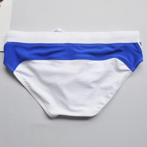 Flat lay of men's color-block swim briefs in white and royal blue with drawstring waist