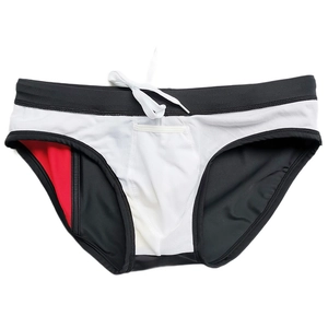 Detail of men's color-block swim briefs with white drawstring and breathable inner lining