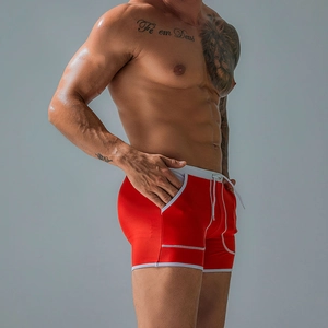 Side view of men's red quick-dry swimming trunks with white contrast trim and drawstrings