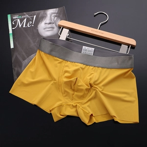Detail of men's seamless ice silk boxers in yellow with grey elastic waistband