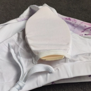 Detail of internal mesh pocket with removable foam pad and tie-dye fabric print