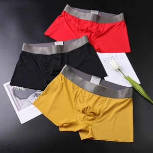 Flat lay of seamless ice silk men boxer briefs showing fabric blend label and elastic waist