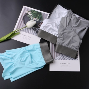 Three-pack ice silk men's boxer briefs in blue, gray, and white with wide elastic waistbands