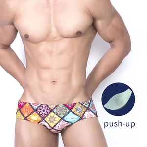 Detail of men's low-rise swim briefs with ethnic print and internal push-up padding