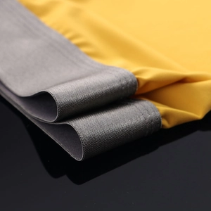 Detail of ice silk fabric with gray honeycomb elastic waistband and yellow stitching