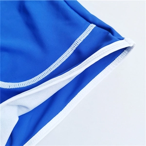 Detailed close-up of quick-dry swim trunks featuring navy fabric and mesh lining