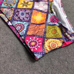 Close-up of bohemian mandala print on quick-dry fabric with detailed white stitching