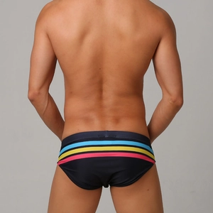 Detail of navy men swim briefs featuring colorful stripes and high-quality back stitching