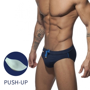 Detail of navy swim briefs with push-up cup padding and bright blue drawstring ties