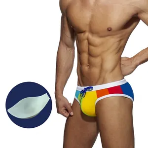 Detail of rainbow swim briefs featuring contrast white trim and removable sponge pad cup