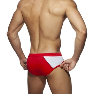 Men's low-rise bikini swim briefs in red and white patchwork design with muscle fit