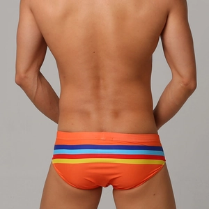 Men's bright orange swim briefs with vibrant multi-colored stripes and slim fit design
