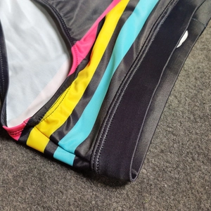 Close-up of colorful striped swimwear showing high-elasticity fabric and waistband