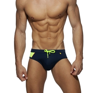 Men's navy blue nylon swim bikini brief with neon yellow accents and contrast drawstring