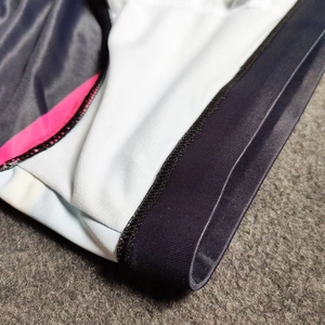 Detail of flatlock seams and quick-dry striped fabric on men's bikini swim briefs