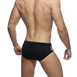 Men's black swim briefs featuring checkered side panels and athletic fitted design