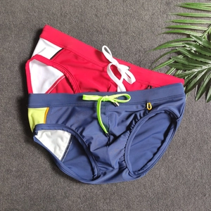 Close-up of men's athletic swim briefs showing elastic waist with contrast drawstrings