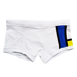 Detail of men's square-cut swimwear with blue, black and yellow geometric color-blocking