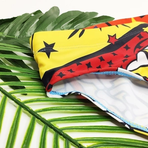 Detailed close-up showing the elastic comic print fabric and reinforced stitching quality
