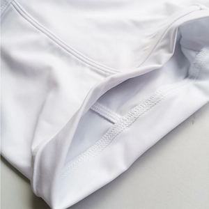 Close-up of white high-elastic fabric with precision double-needle flat stitching detail