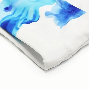 Detail of blue ink painting print on men's white swimwear with double stitching