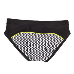 Detail of men's swim briefs with mosaic patterns and yellow contrast stitching detail