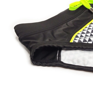 Detail of men's swim briefs showing geometric mosaic print and neon drawstring