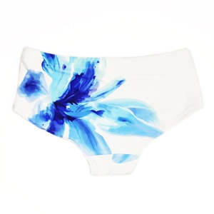 Detail of blue floral ink painting pattern on high-waist white cotton swim shorts