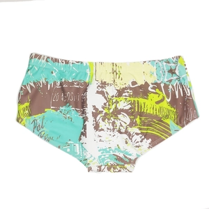 Detail of men's swim trunks featuring graffiti island palm tree print on quick-dry fabric